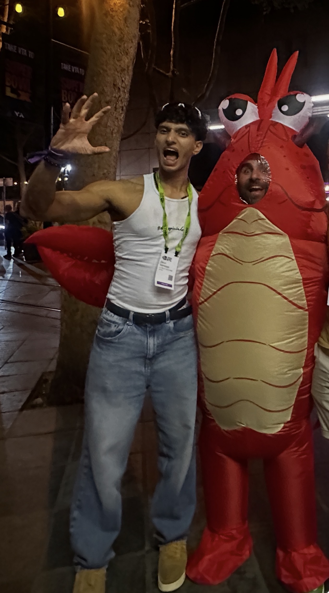 Deon holding the MoltCompany lobster at a hackathon